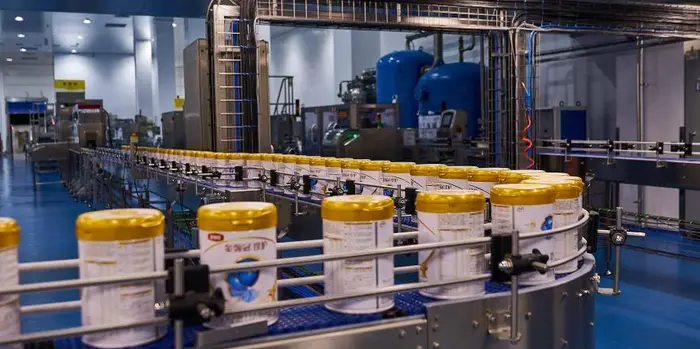 Modular clean room panels being installed in a dairy processing line