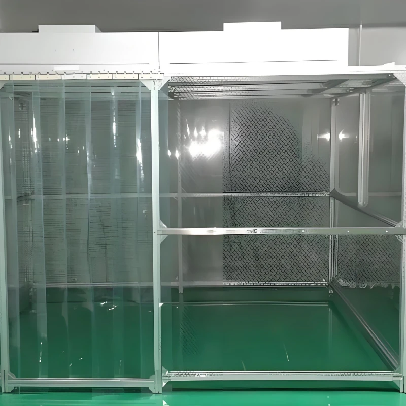 Operator performing glove-based handling inside an Acrylic Clean Enclosure with integrated lighting and airflow monitor